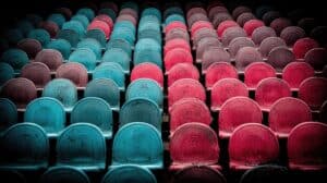 Colorful stadium seats in shades of blue, red, and black, highlighting virtual entertainment setting.